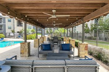 Covered outdoor patio with comfortable lounge seating